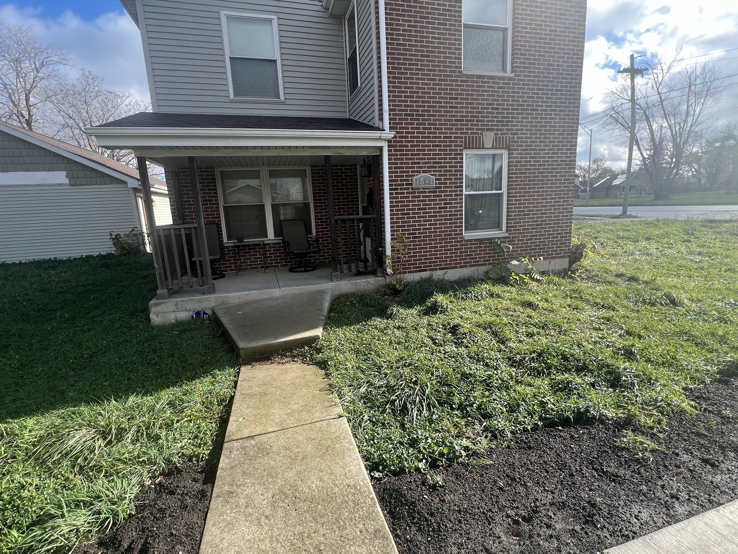 front view of a house with a yard