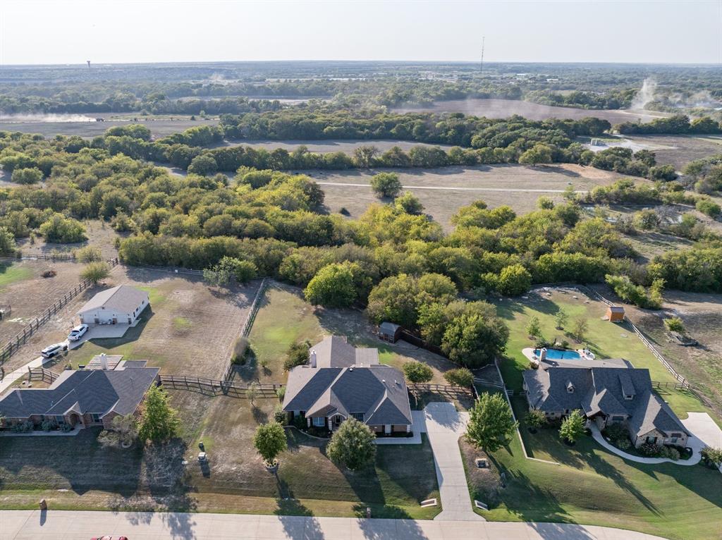 an aerial view of a house with a lake view