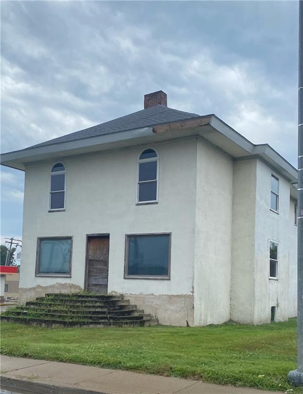 a brick house with lots of windows on it