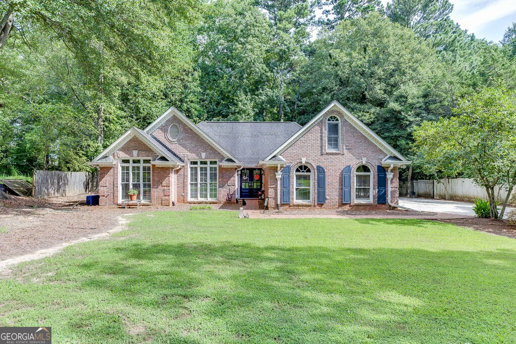 a front view of a house with a yard