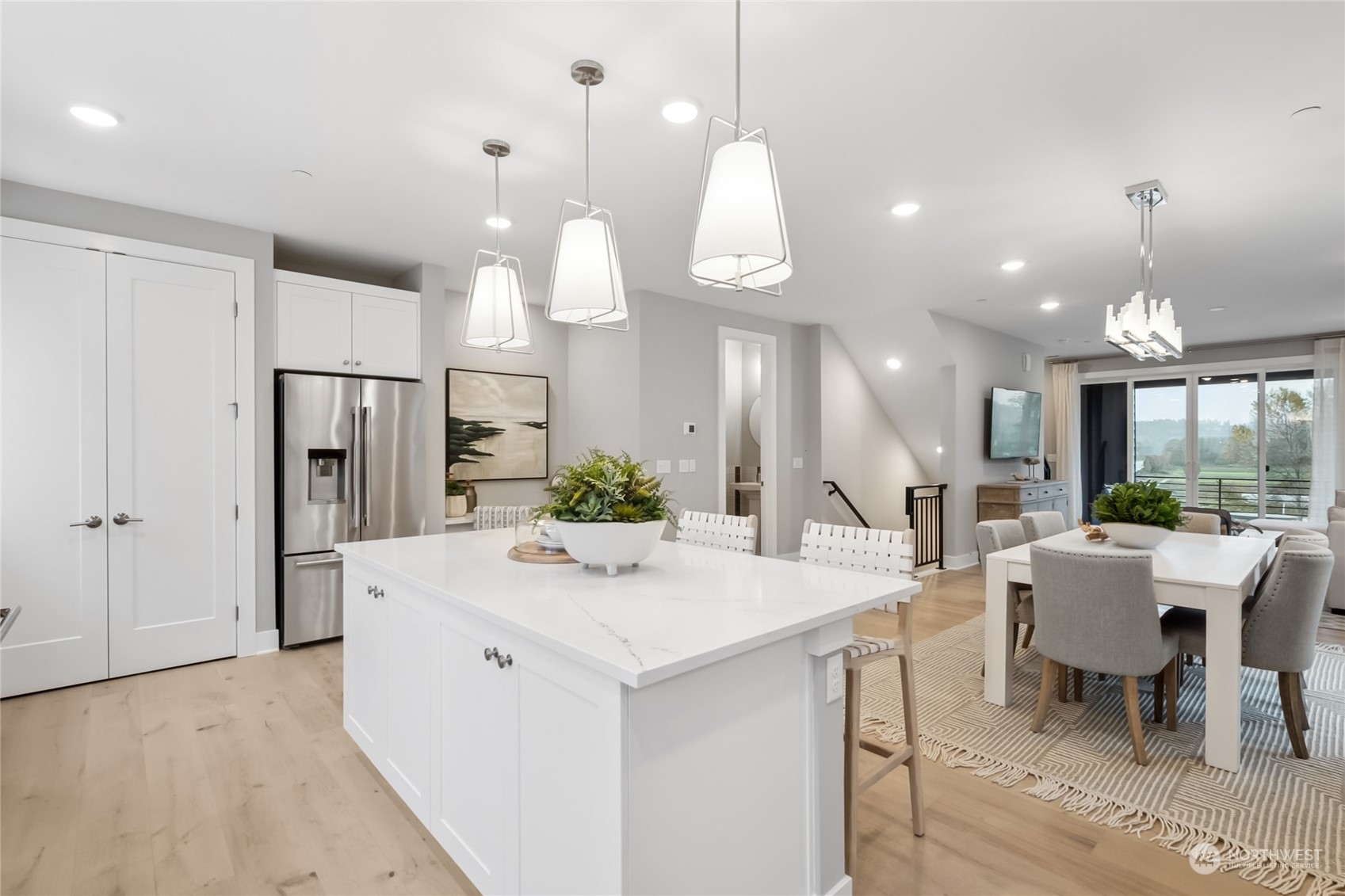 a large kitchen with a table and chairs