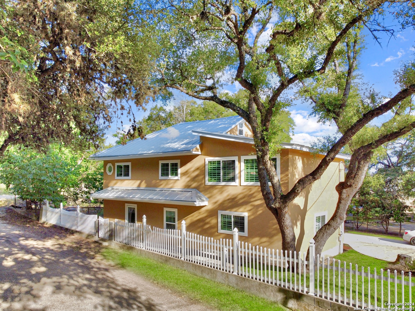 a house that has tree in front of it