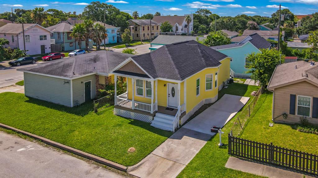 a aerial view of a house with a yard