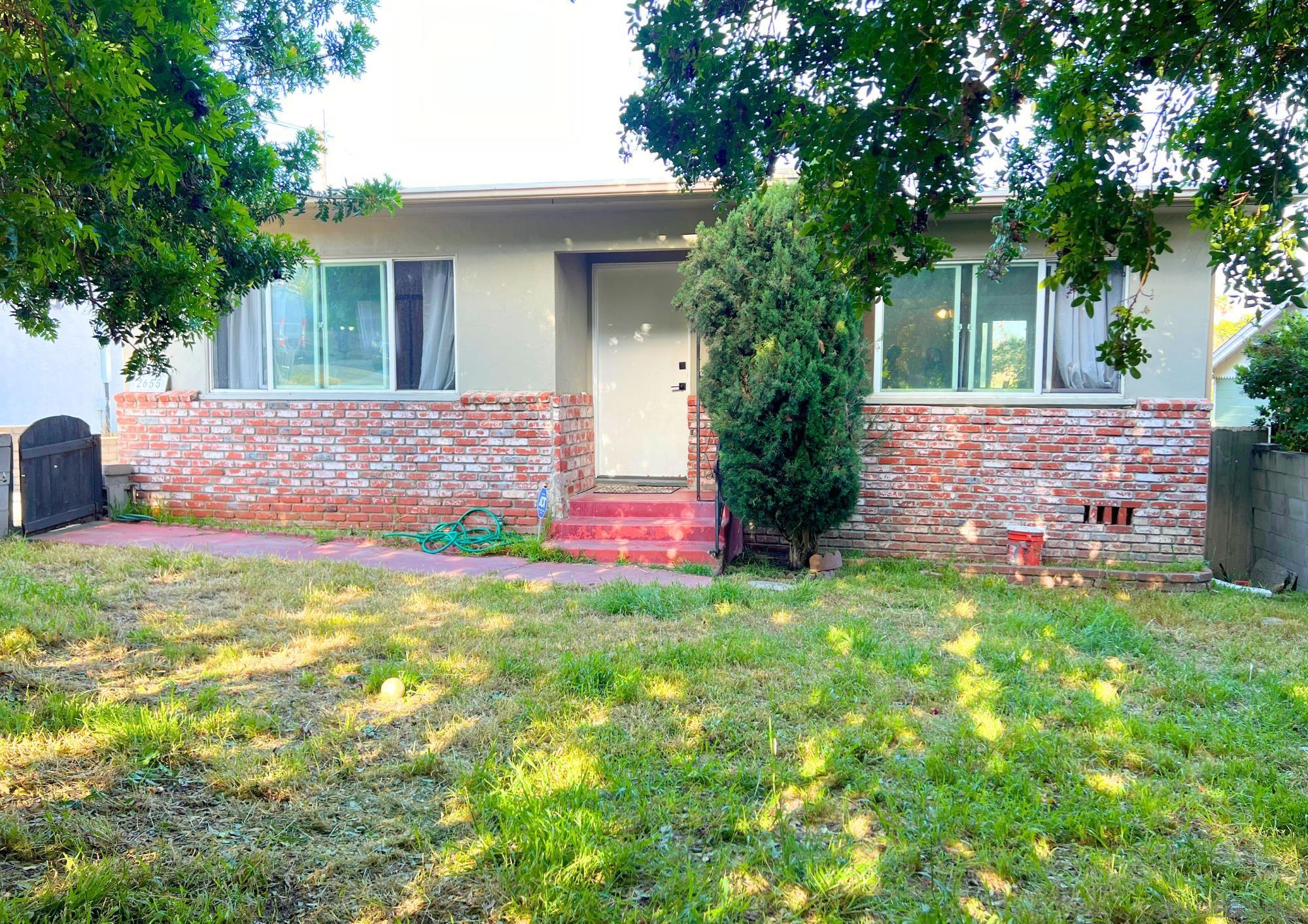 a front view of a house with yard