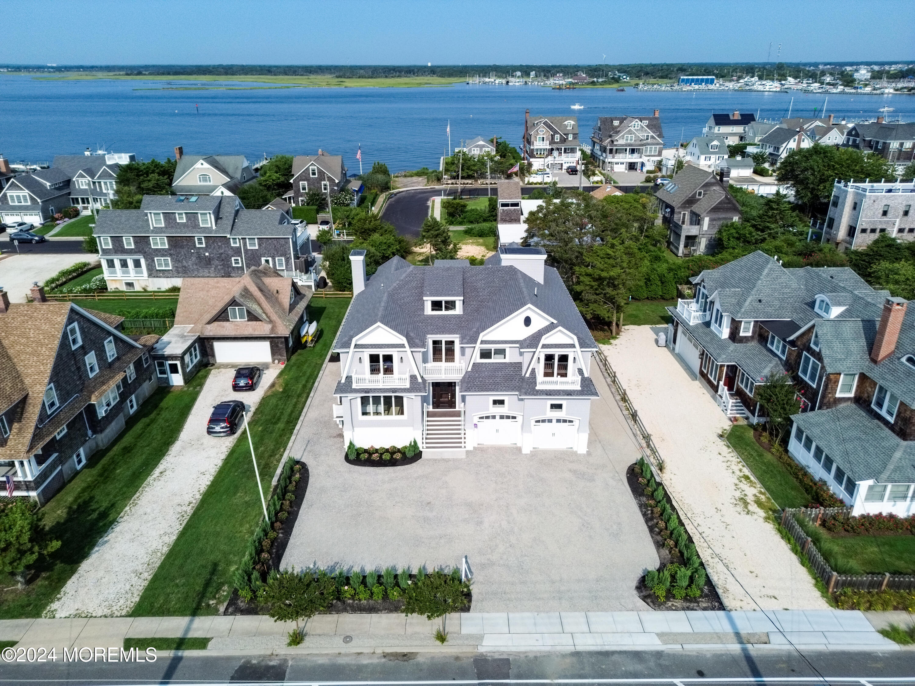 an aerial view of multiple houses with yard