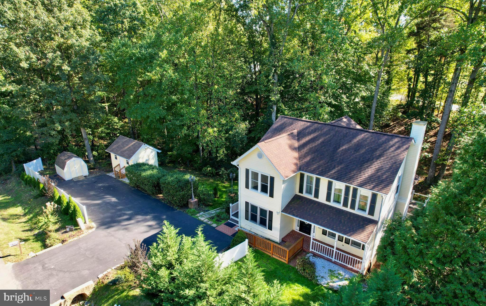 an aerial view of houses with yard