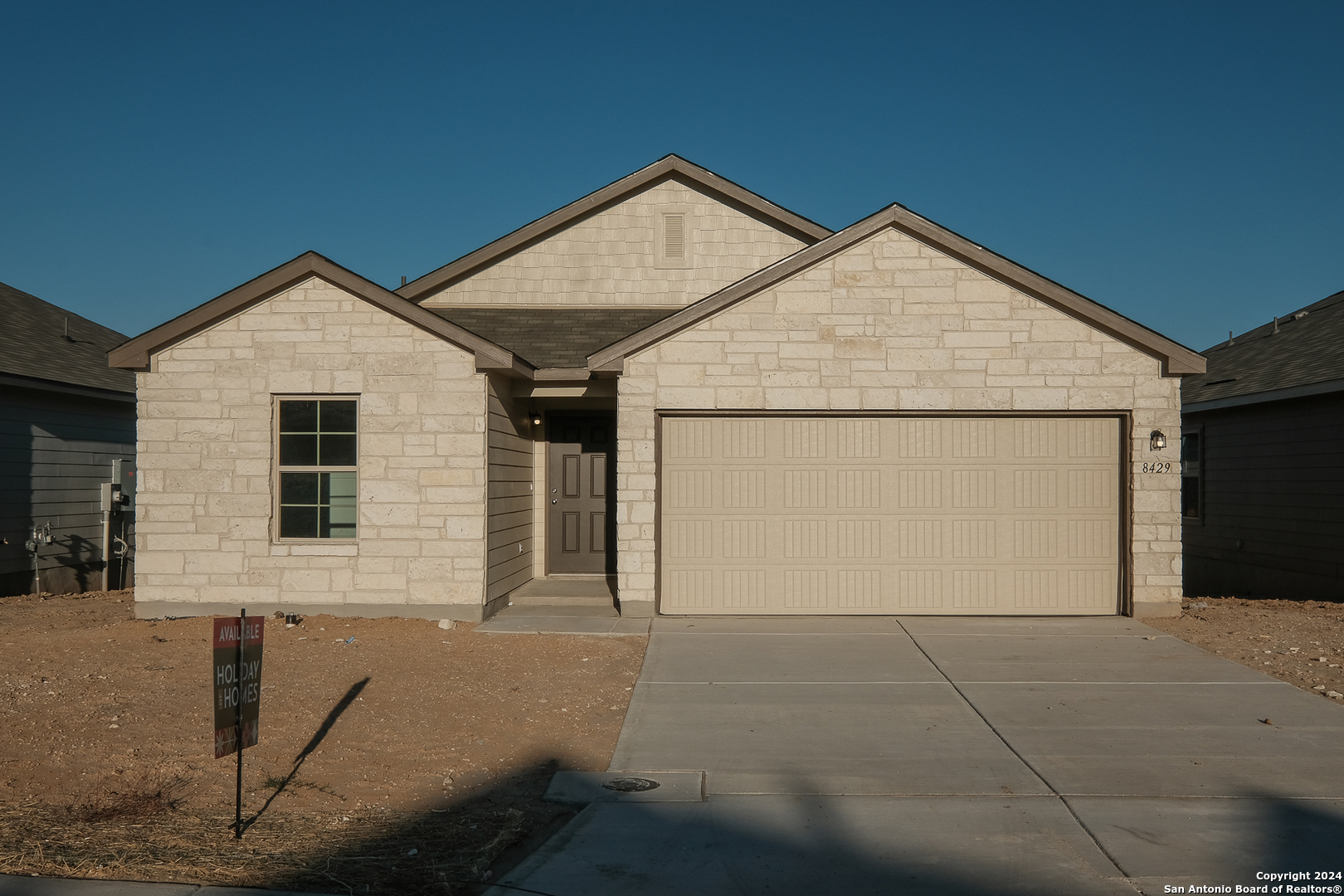 a front view of house with garage