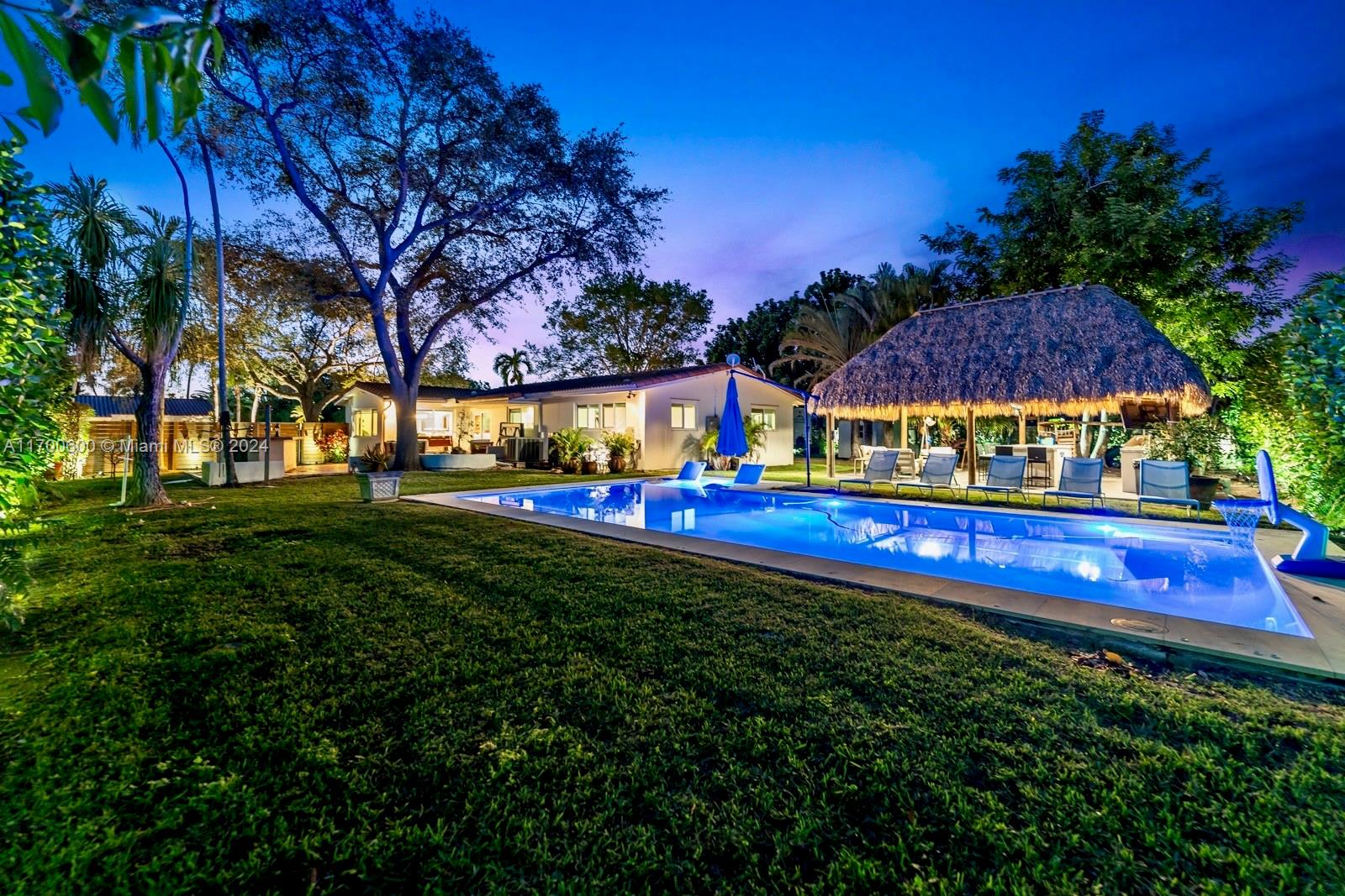 a view of yard with swimming pool and outdoor seating