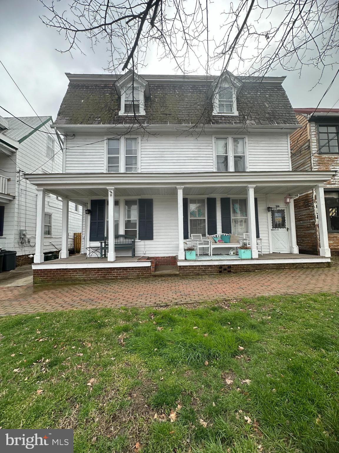 front view of a house with a yard