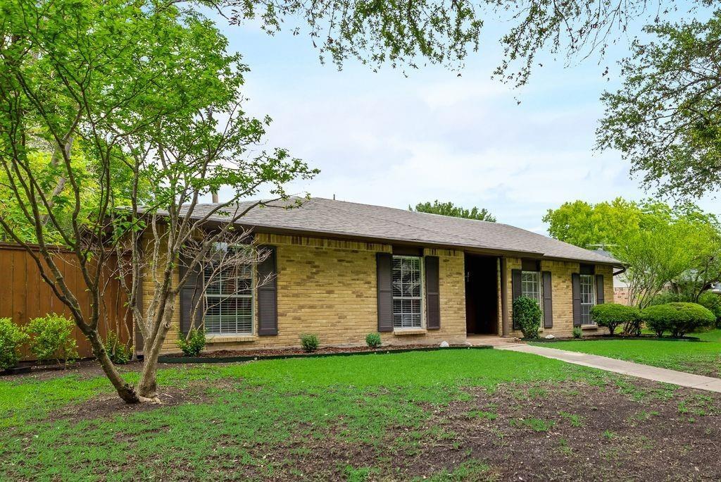 front view of a house with a garden