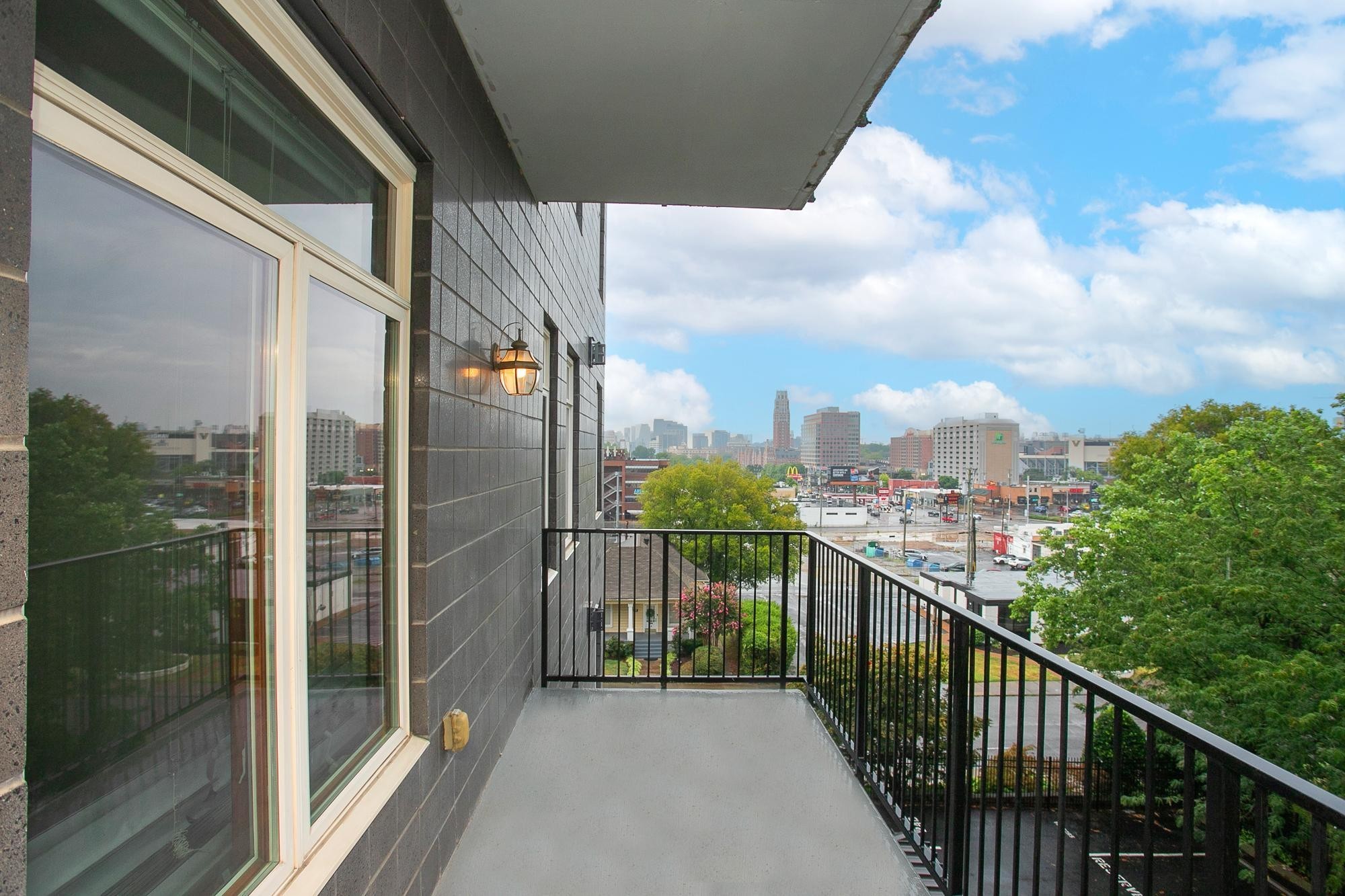 a view of a balcony with city view