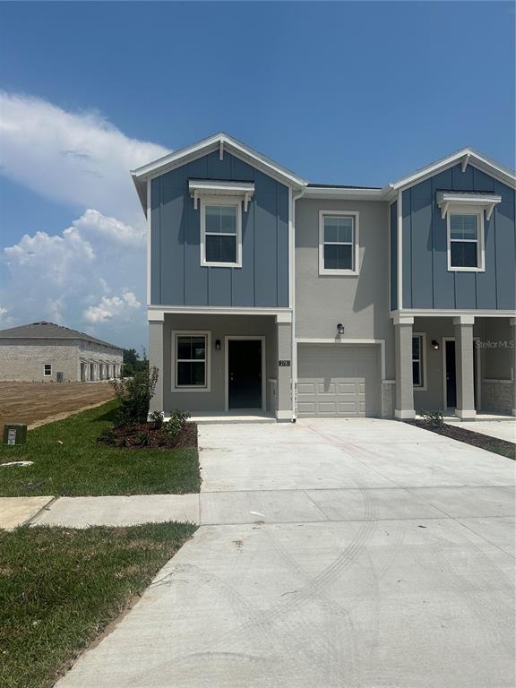 a front view of a house with yard