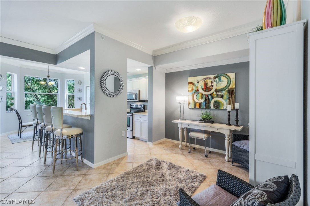 a living room with furniture and a clock