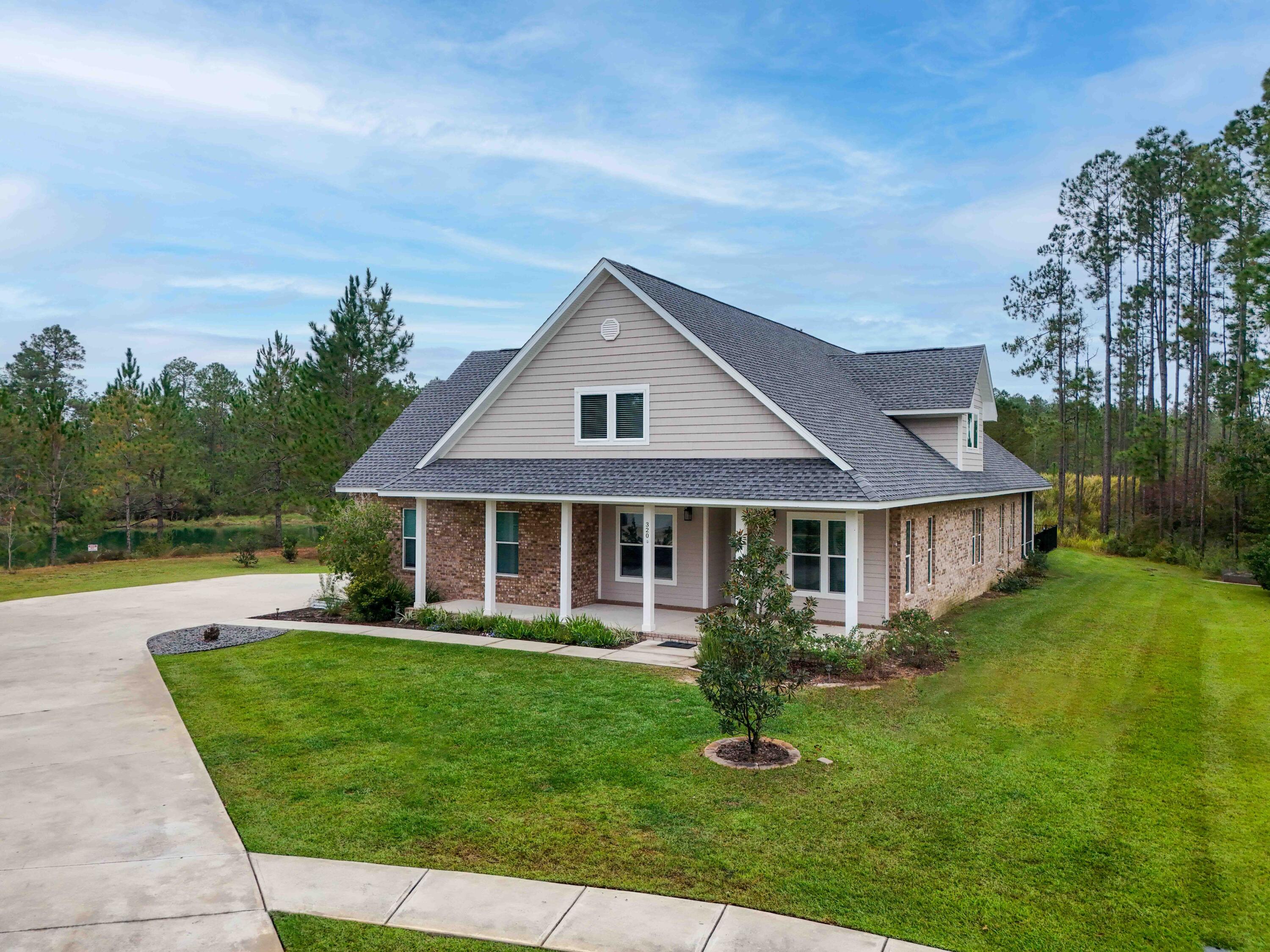 front view of a house with a yard