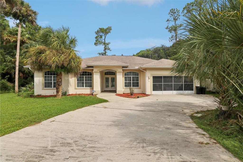 front view of a house with a yard