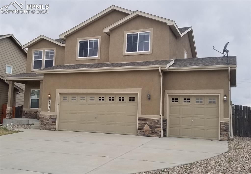 View of front facade with a garage