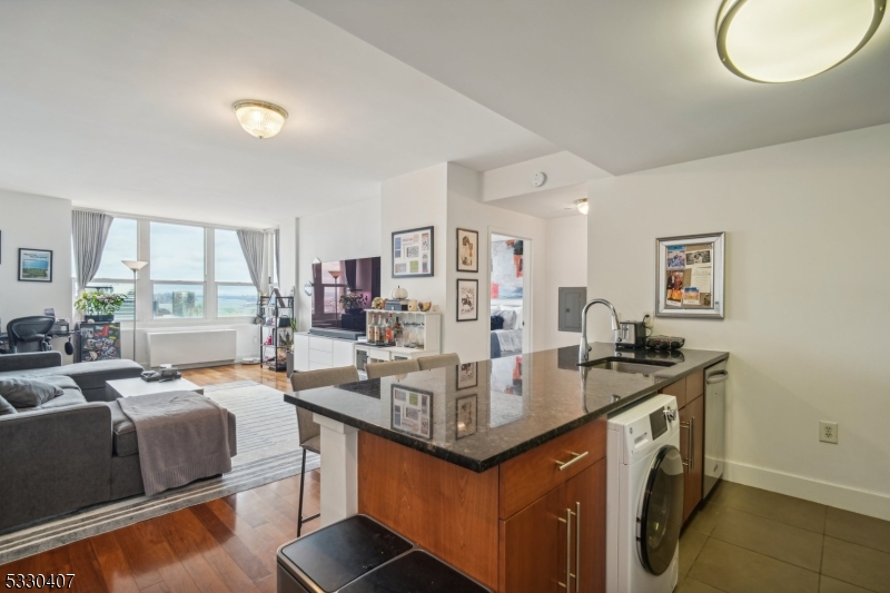 a view of living room with granite countertop furniture and a table