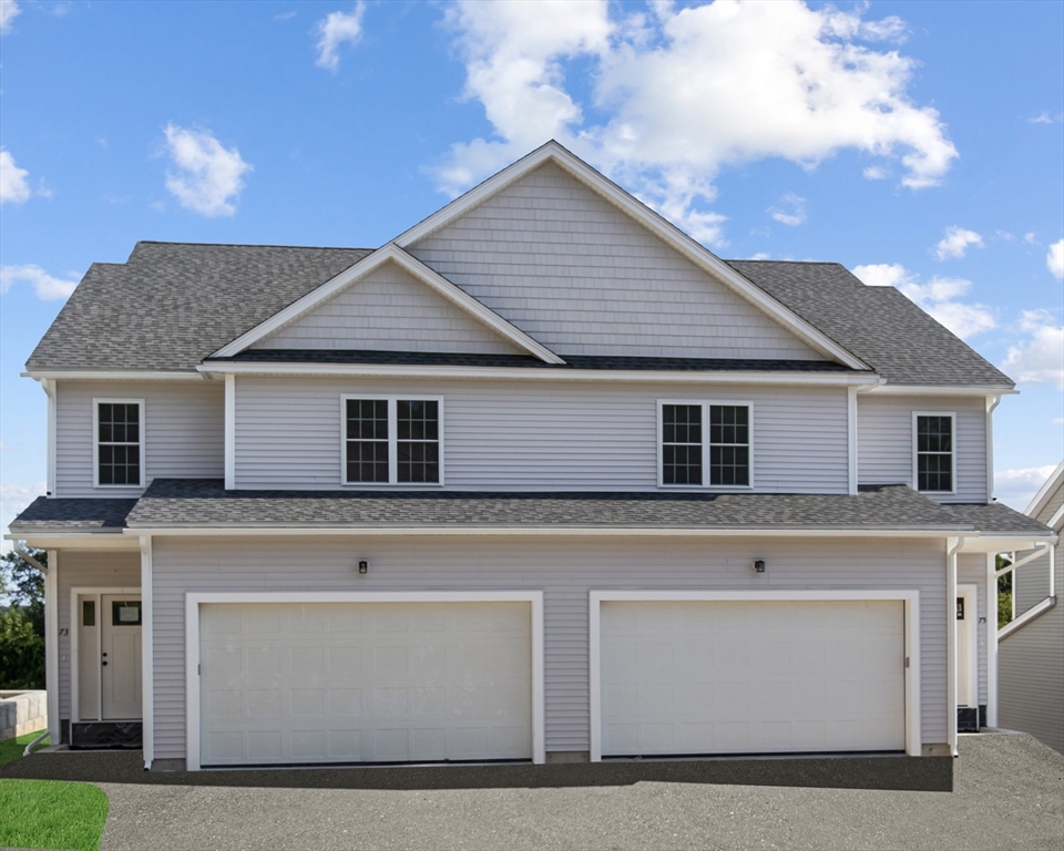 a front view of a house with a garage