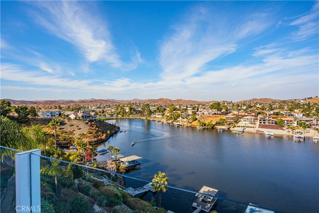 an aerial view of a houses with city view