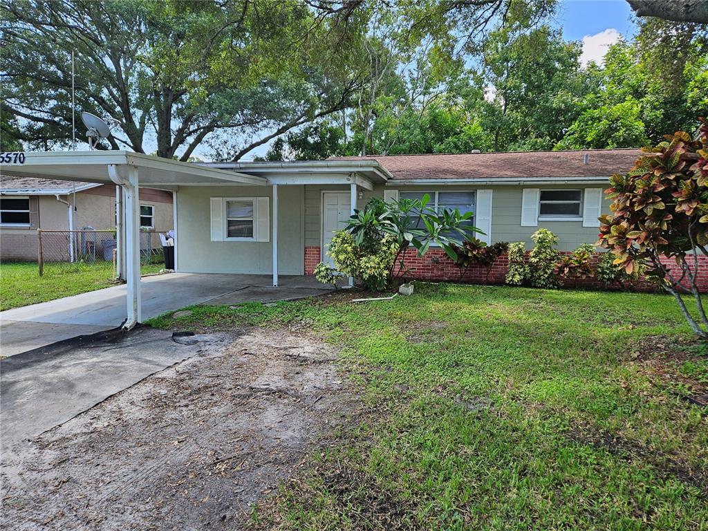 a view of a house with garden and yard