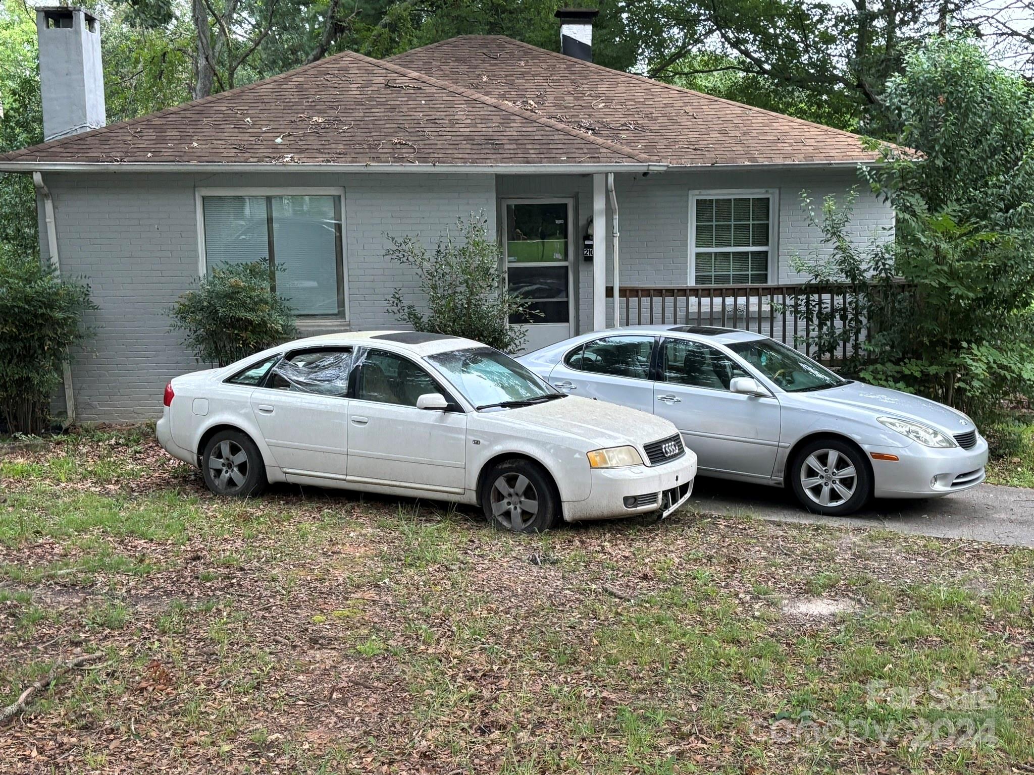 a view of a car parked in front of a house