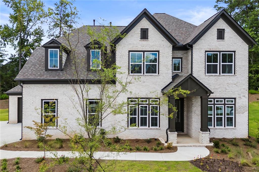 a front view of a house with a yard