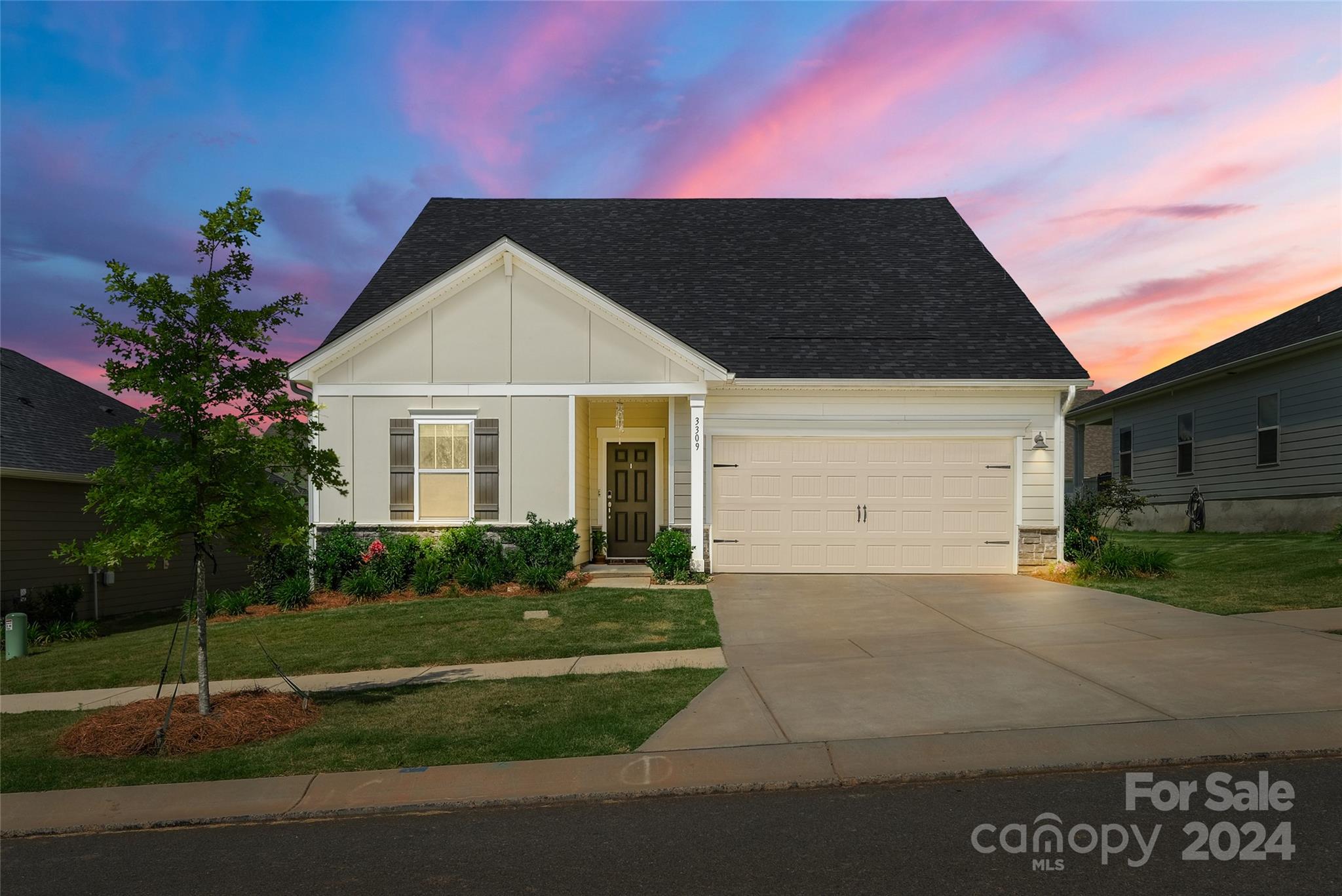 a front view of a house with a yard