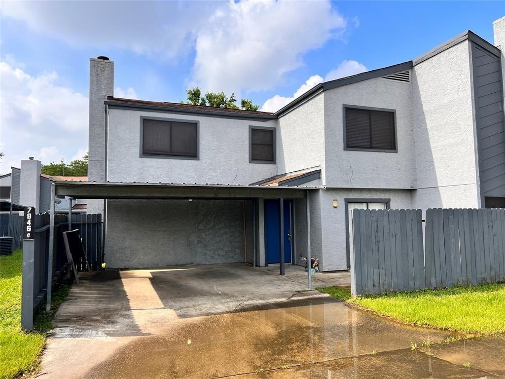 a front view of a house with garage