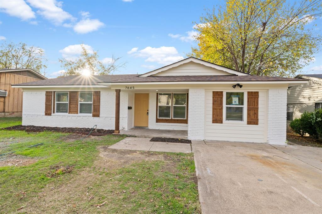 front view of a house with a yard