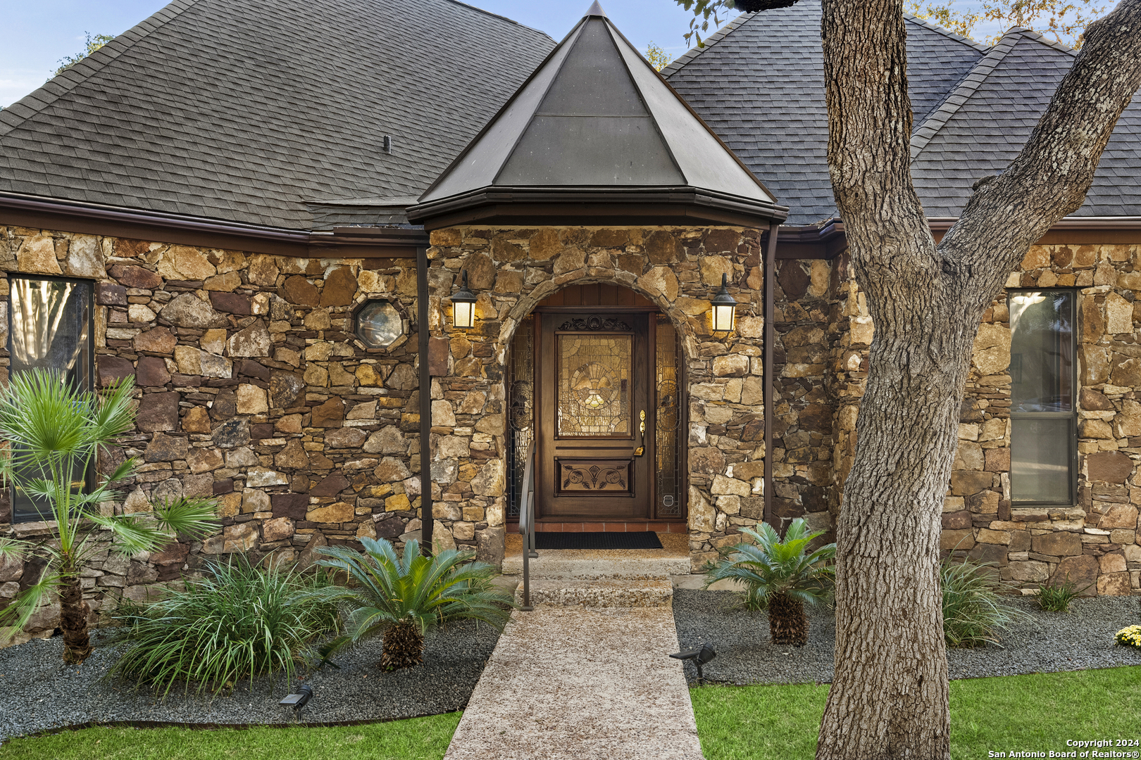 a front view of a house with garden