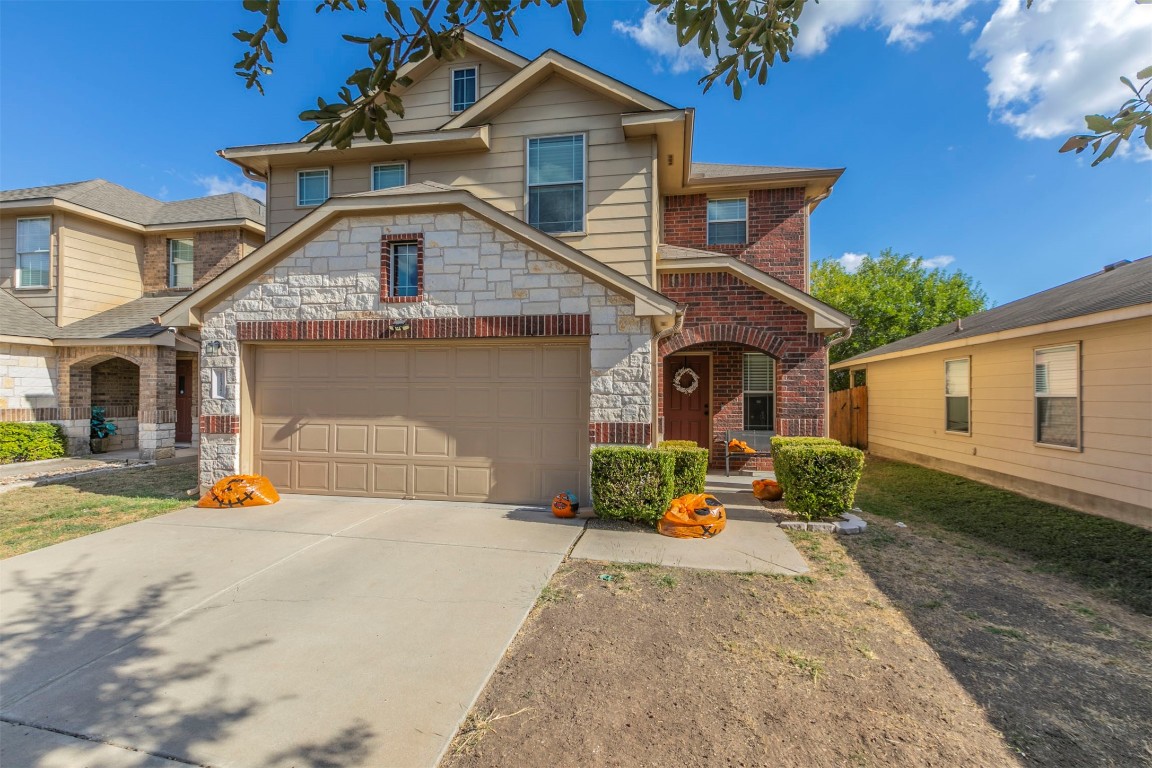 a front view of a house with a yard