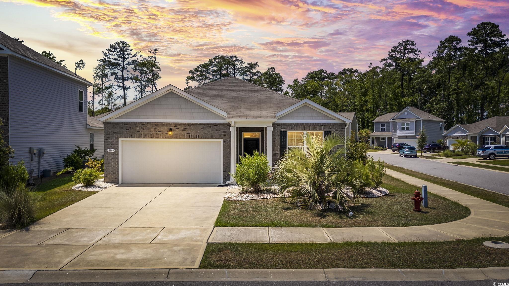 View of front facade with a garage