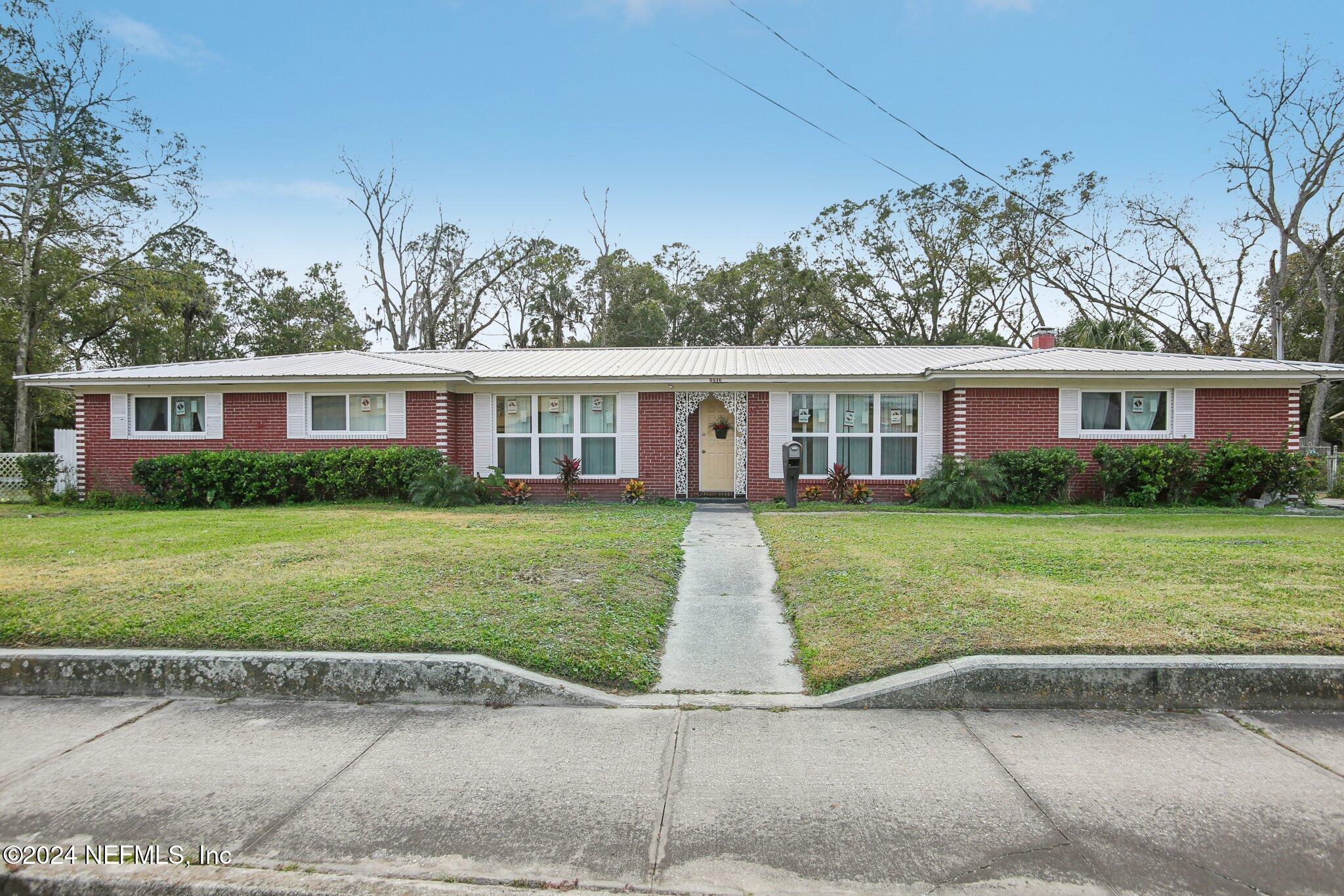 front view of a house with a yard