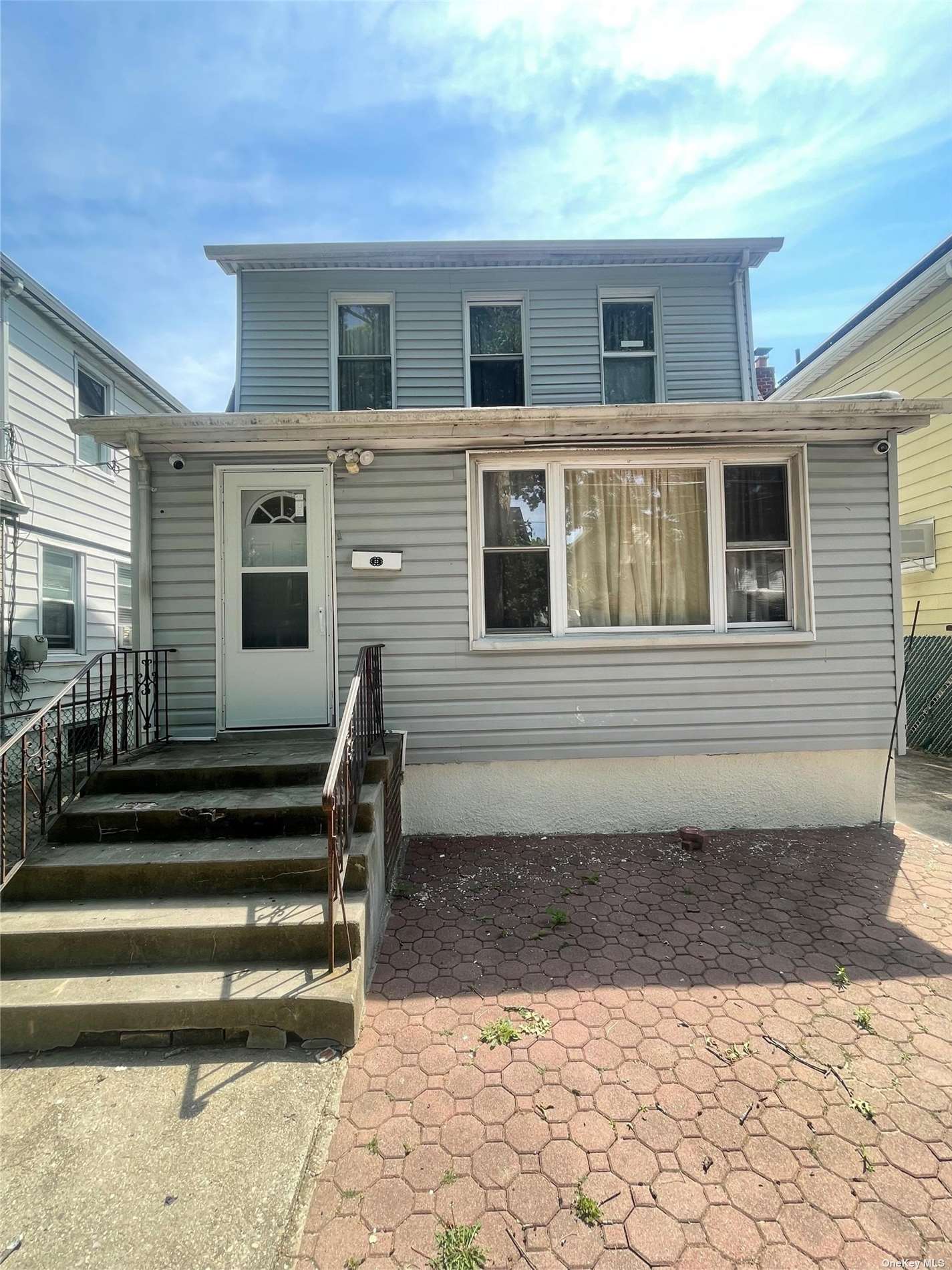 a front view of a house with a chair