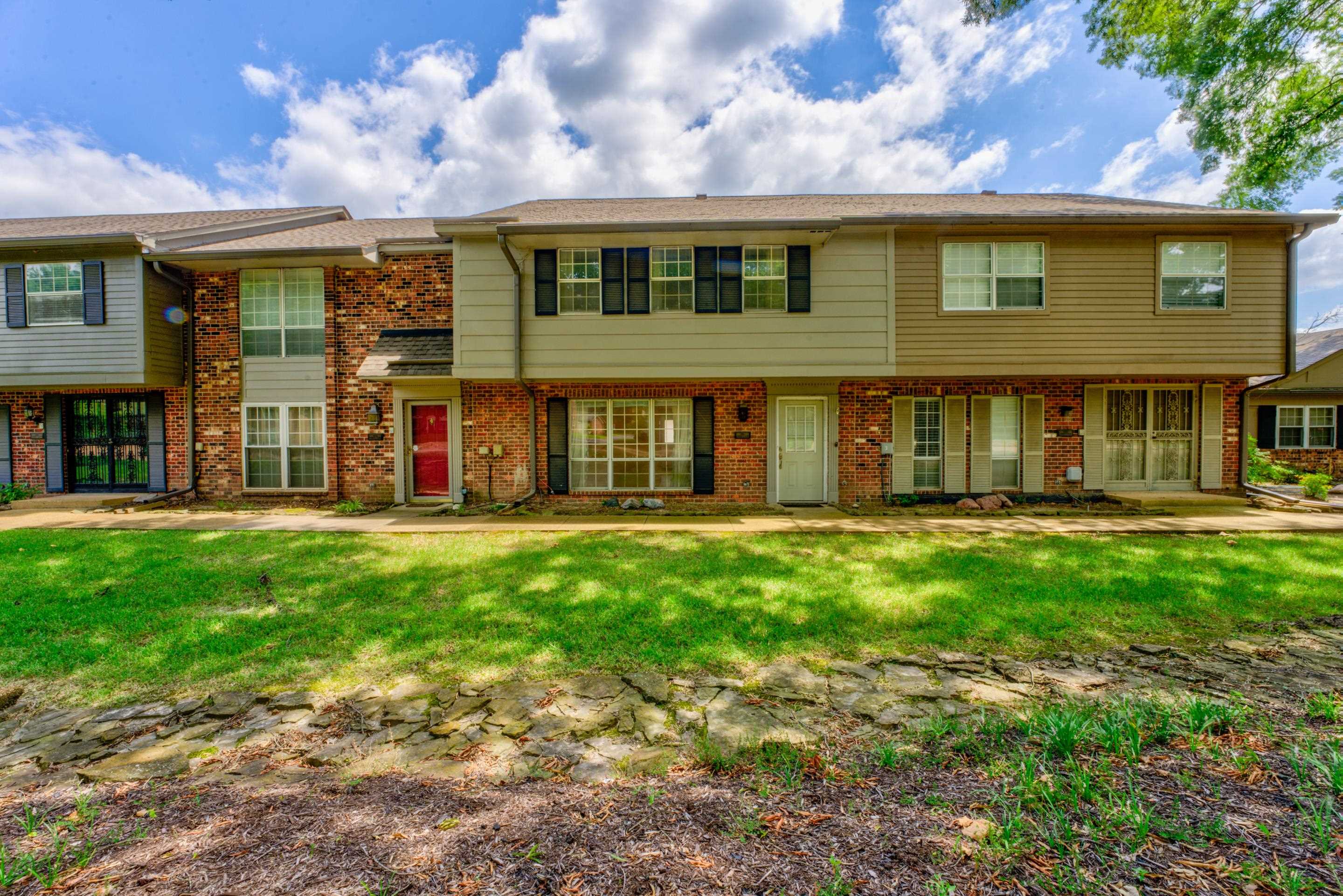 View of front of property with a front yard