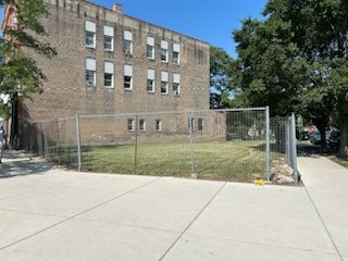 a view of a building with a yard