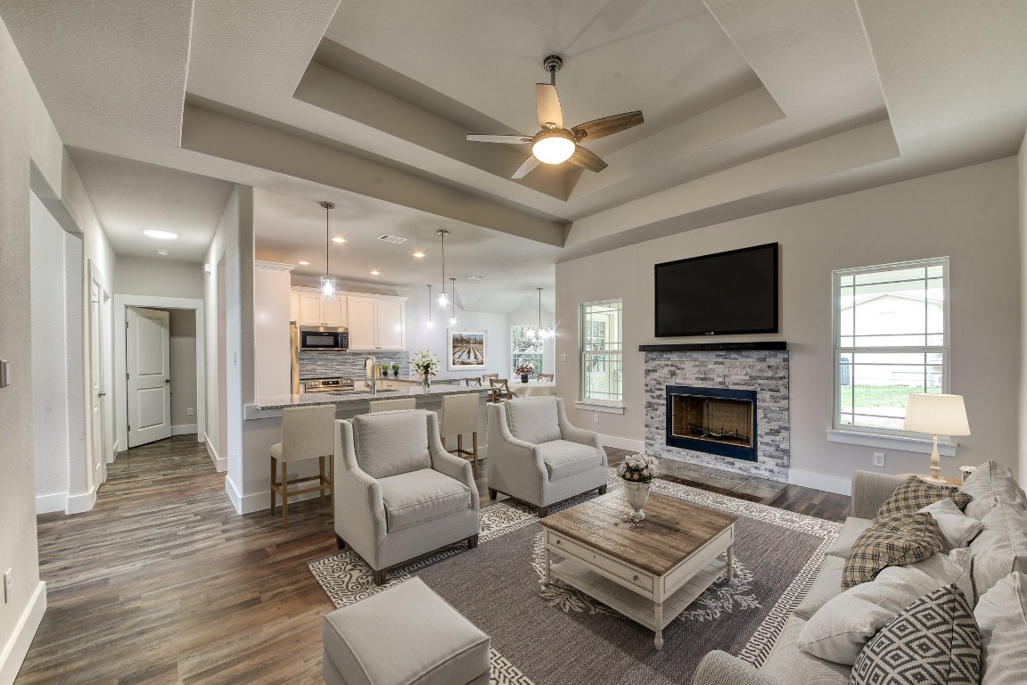 Open floor plan throughout the home with thoughtful design features such as tray ceilings. *Virtually staged*