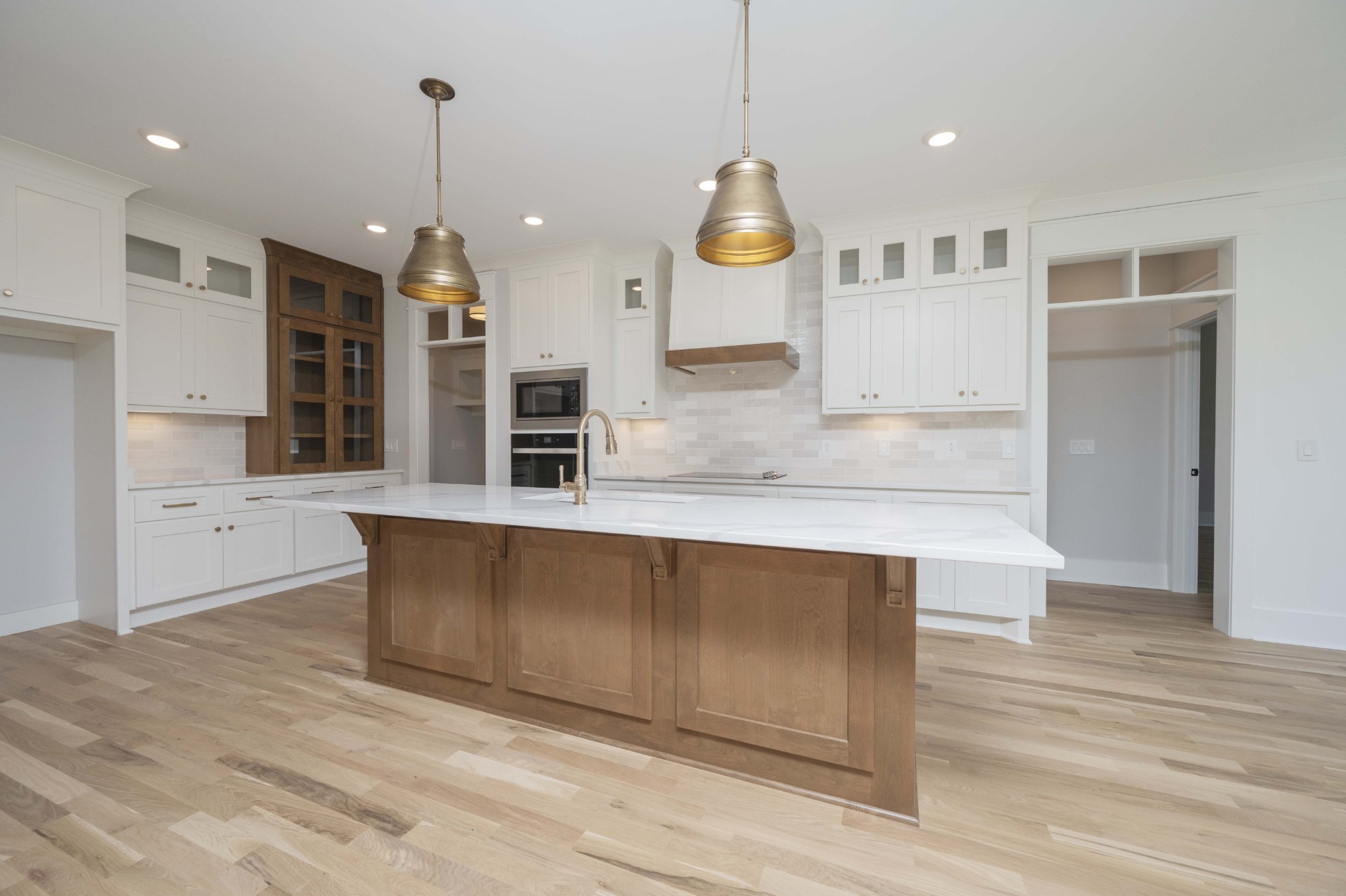 Picture of Similar Home.  Last build of Courtney plan.  Customized cabinets with Hutch & glass doors