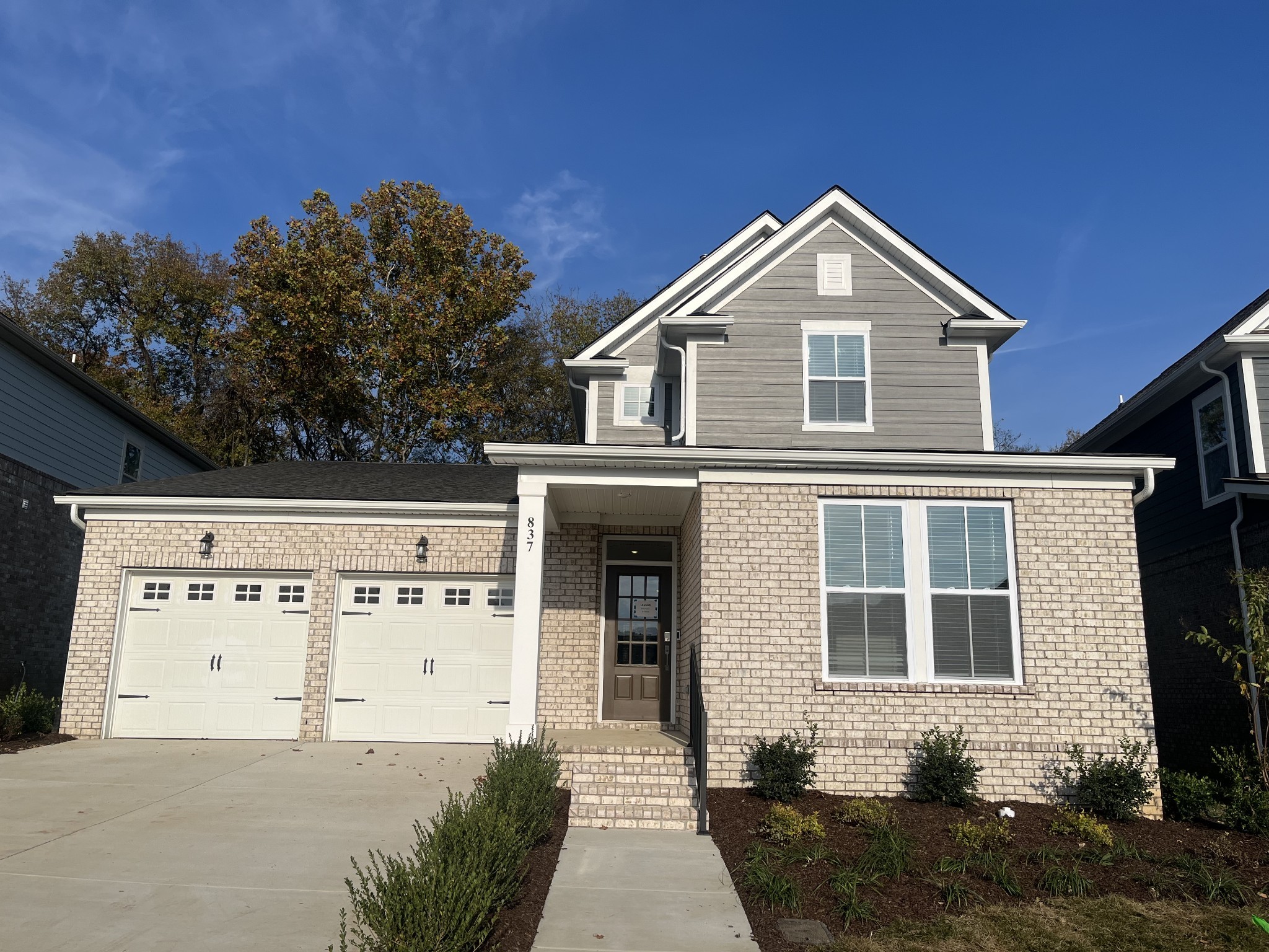 a front view of a house with a yard