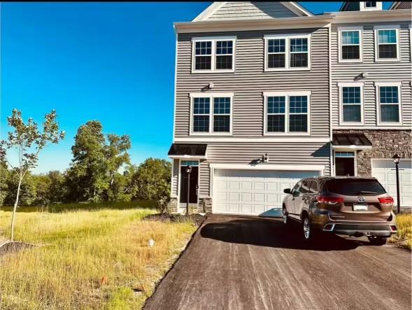 a view of a car parked in front of a house