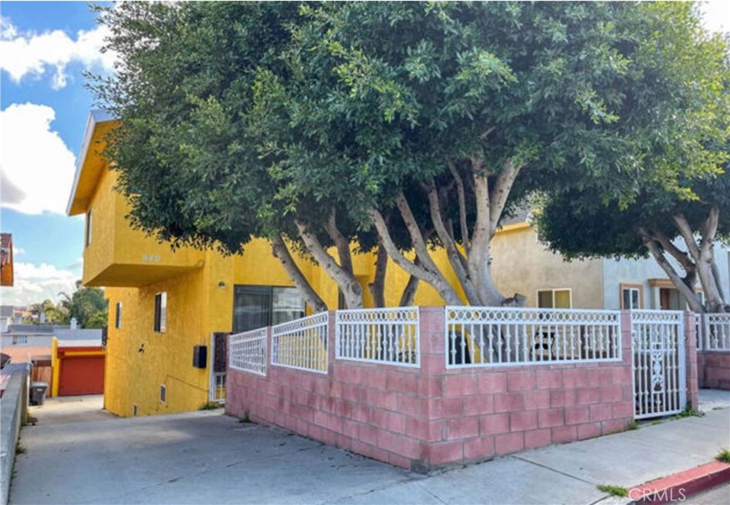 a view of a house with a deck front of house