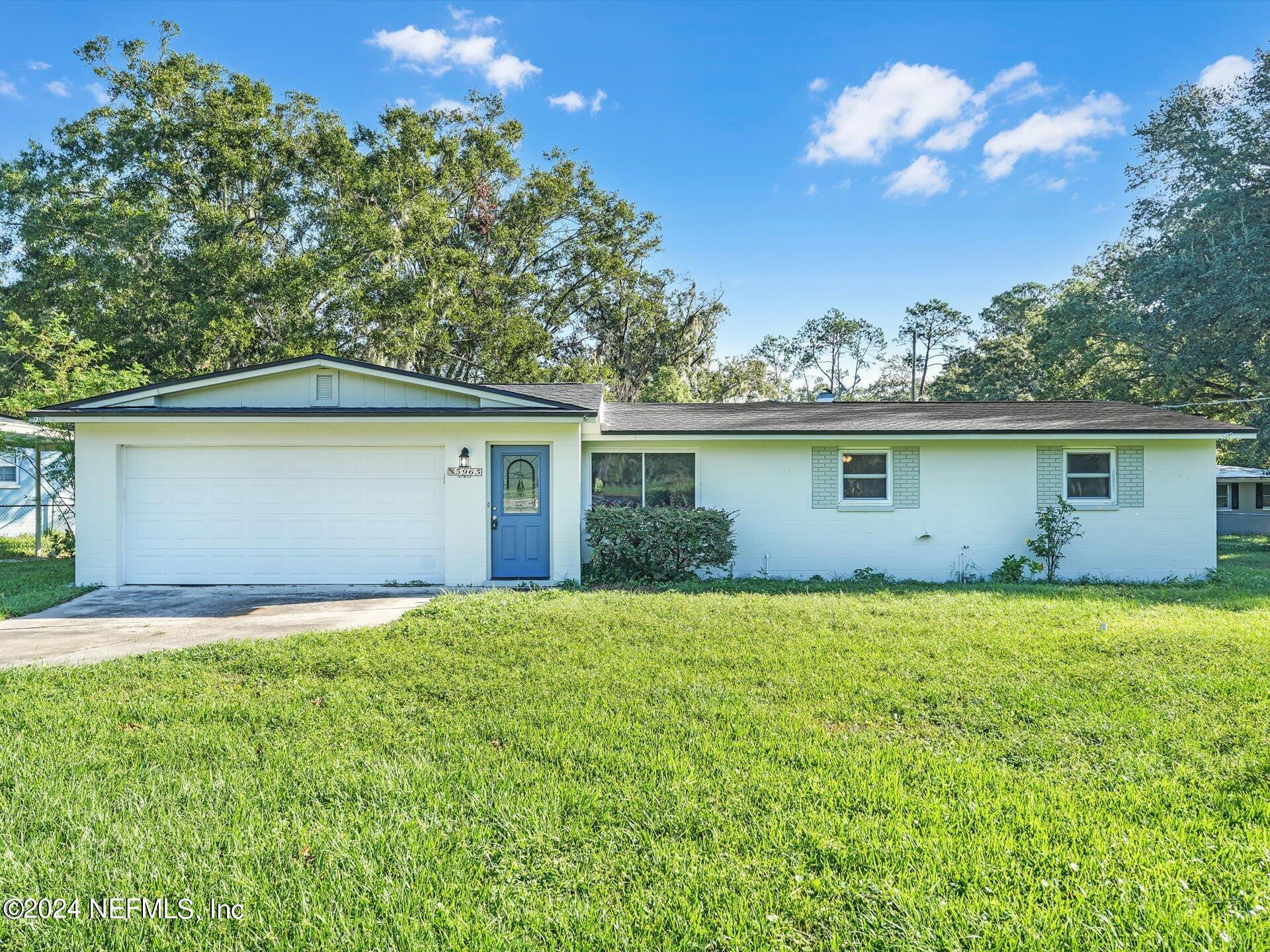 front view of a house with a yard