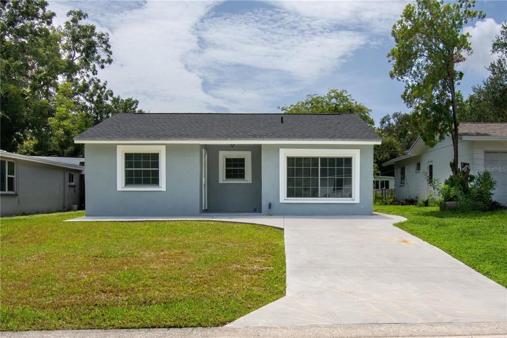 front view of a house with a yard