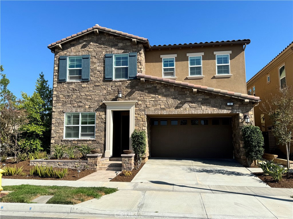 a front view of a house with yard