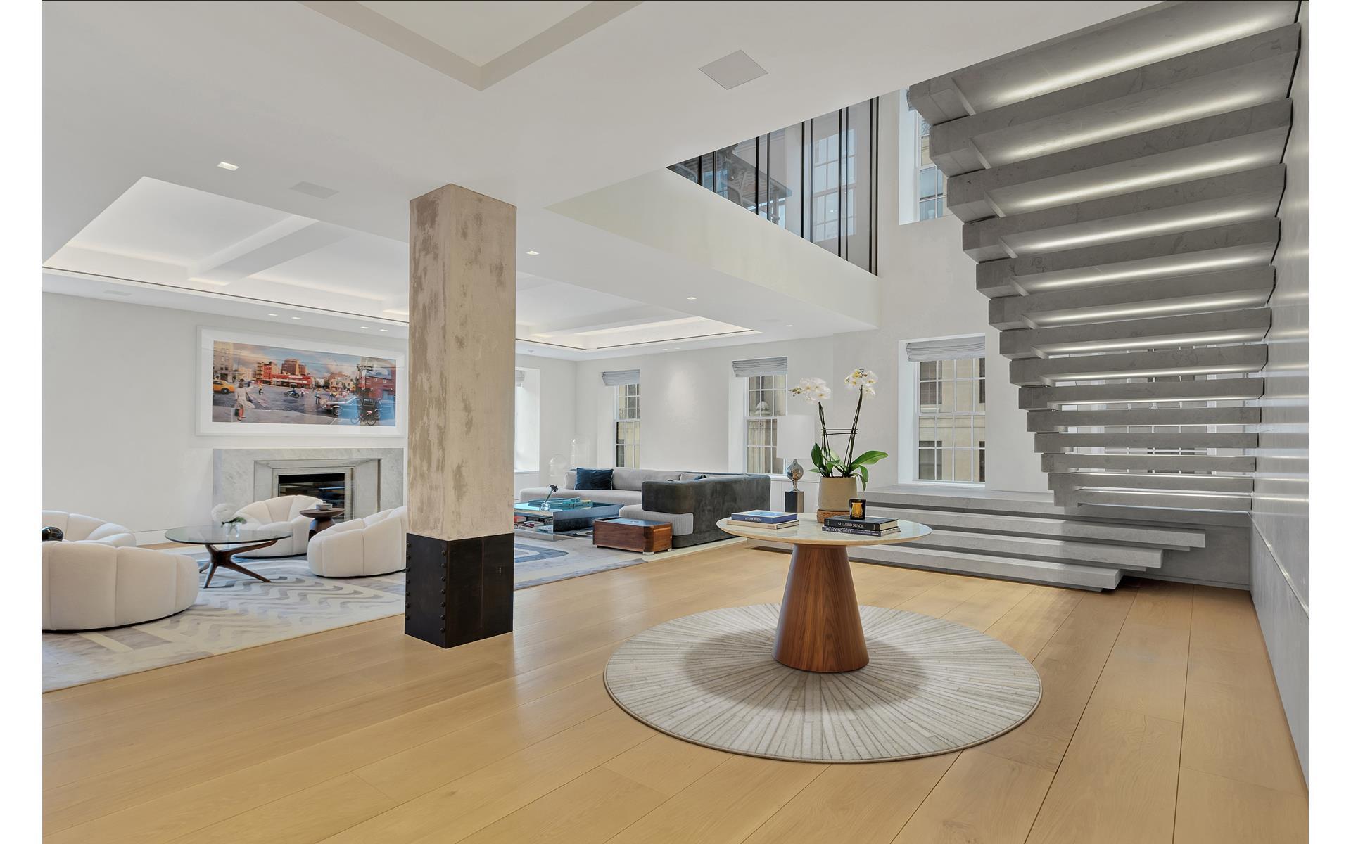 a living room with furniture and a rug