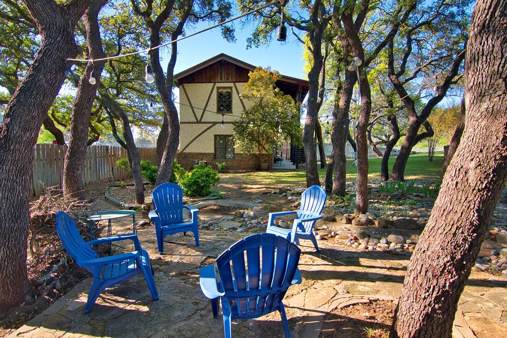 a view of an chairs and table in the patio