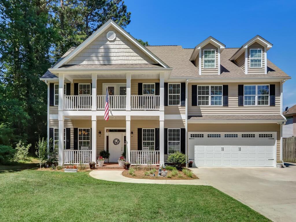 front view of a house with a yard