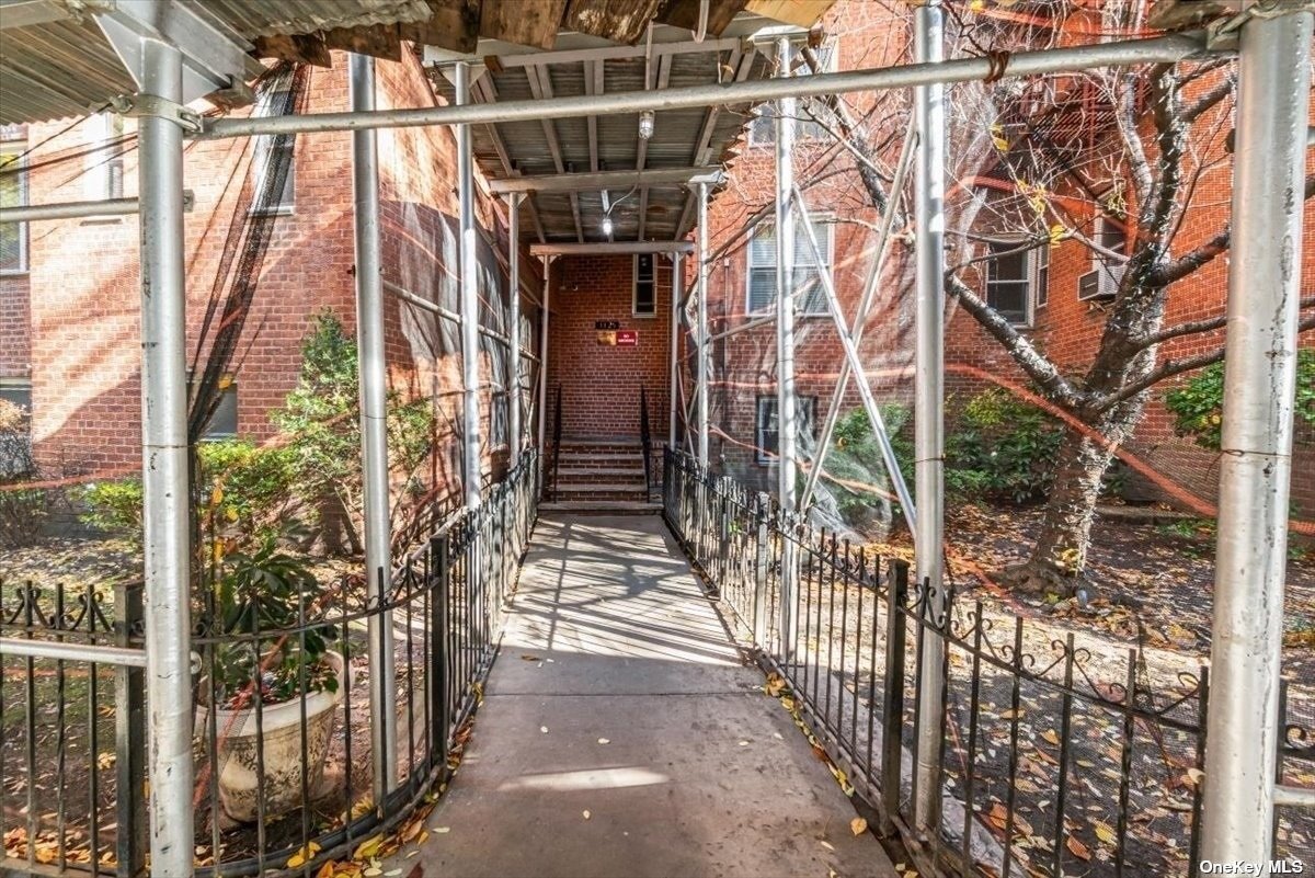 a view of entryway with brick walls