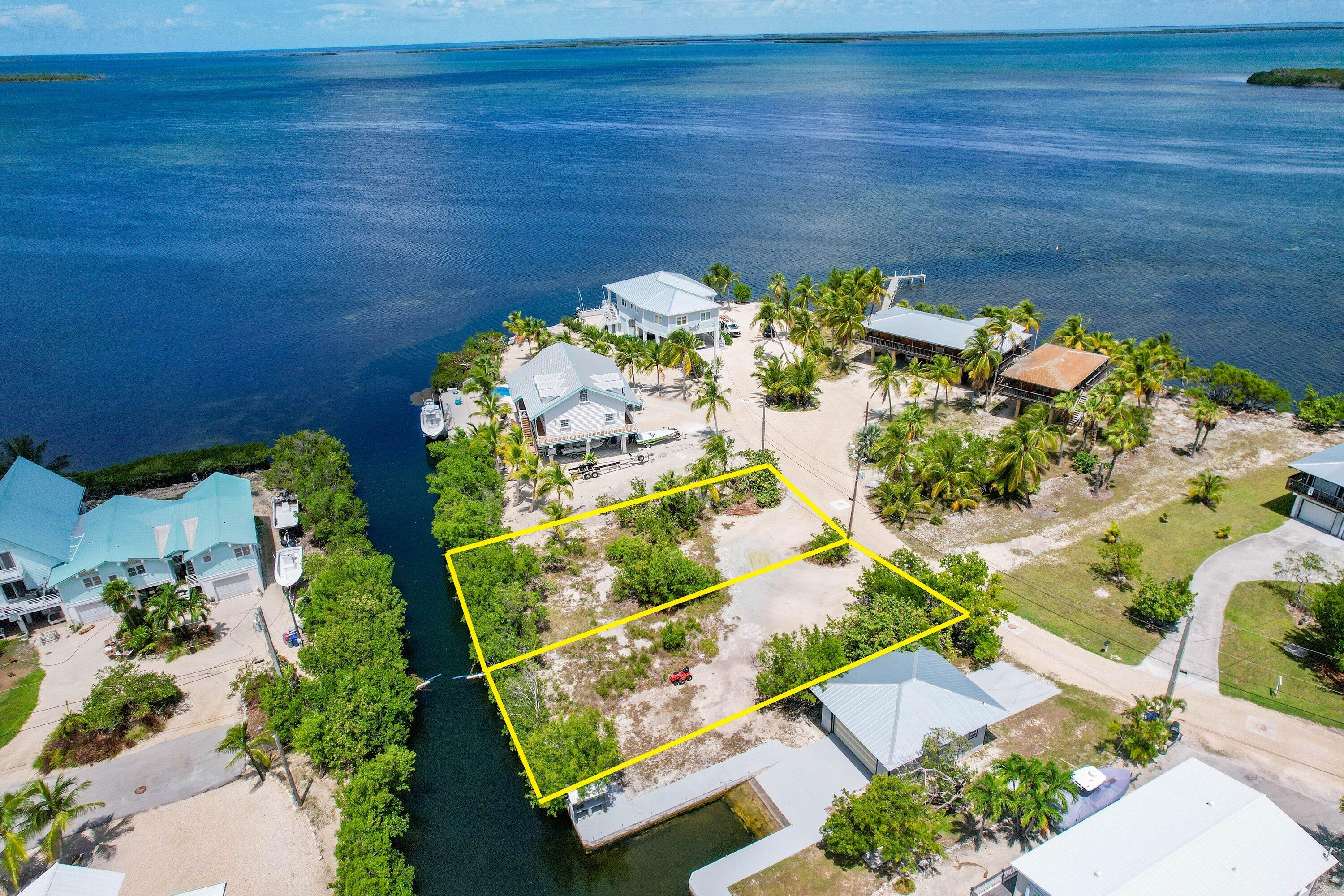 an aerial view of a residential houses with outdoor space