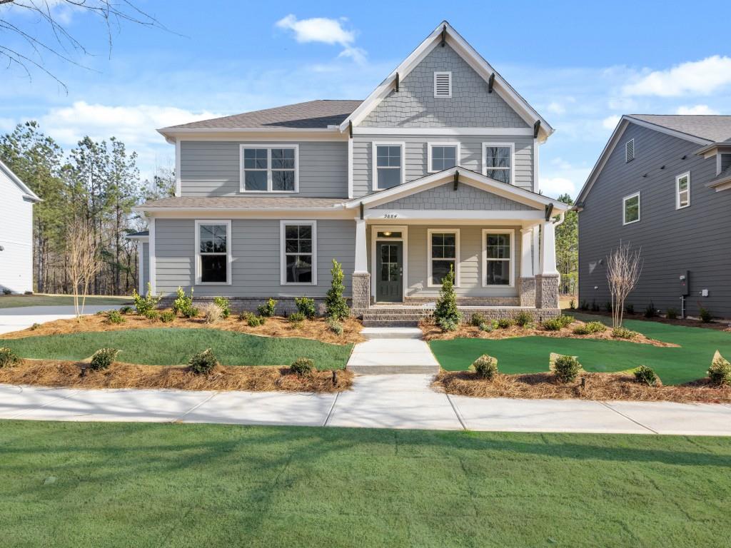 a front view of a house with a yard